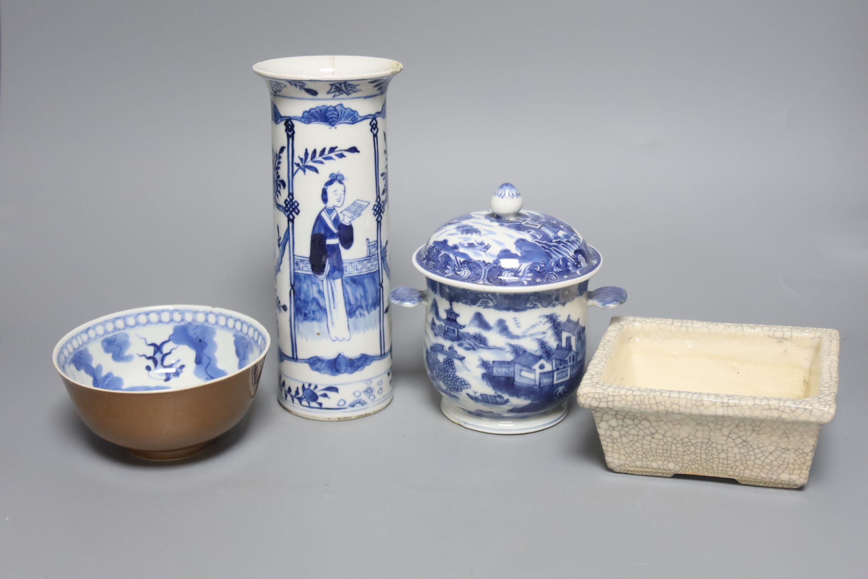 An early 20th century Chinese blue and white sleeve vase, together with a blue and white jar and cover and bowl, and a crackle glaze censer, tallest 21cm